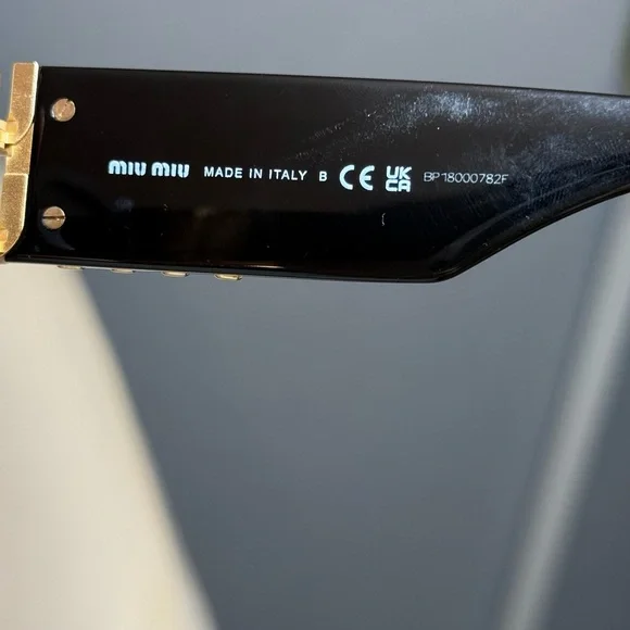 Miu Miu Black Oval Sunglasses with Gold Logo Temples - Picture 4 of 14